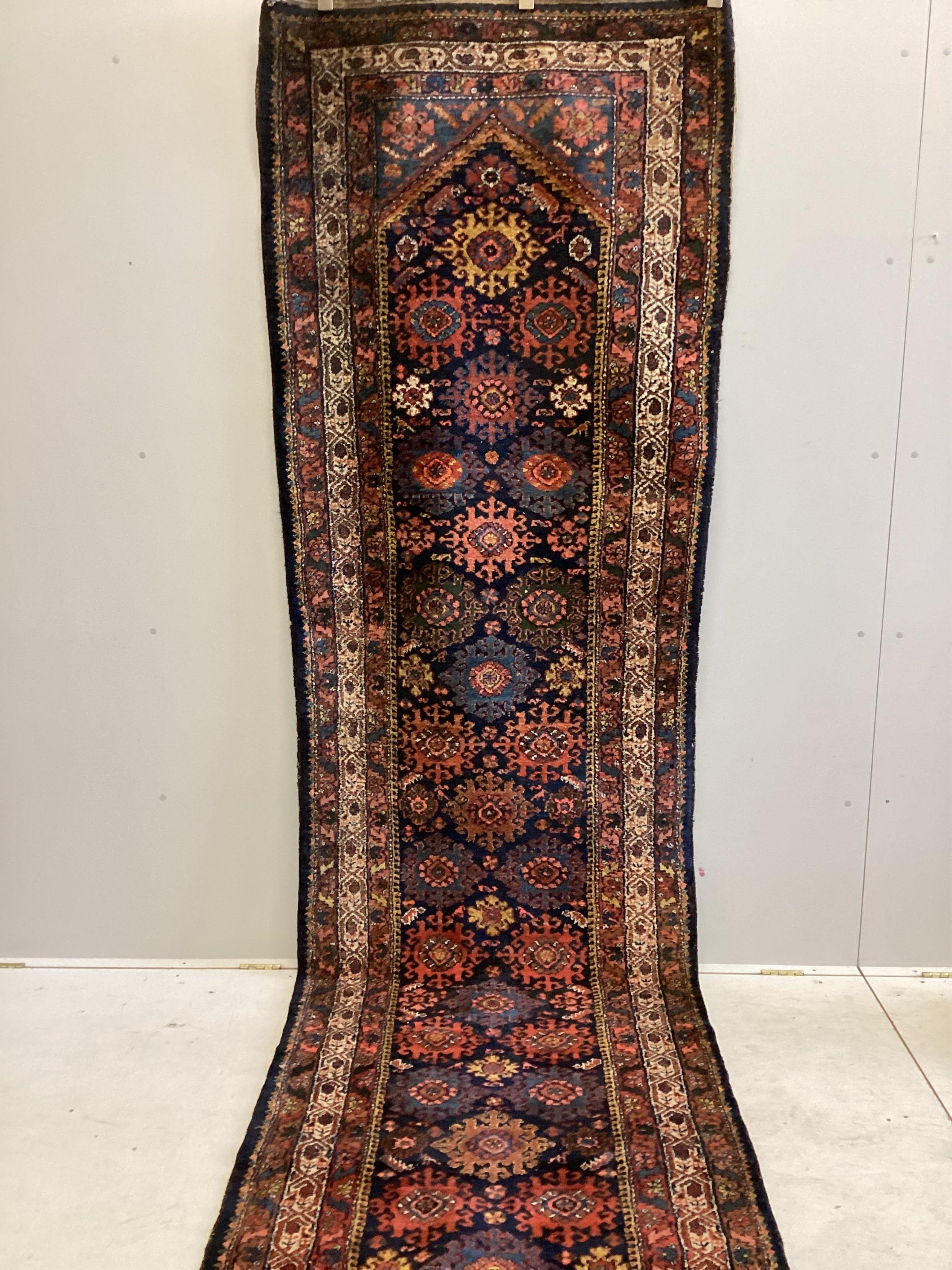 A North West Persian blue ground runner, 480 x 98cm. Condition - fair